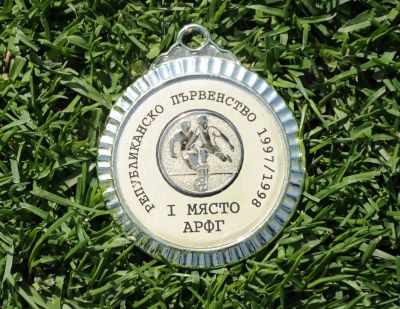 Златен медал, шампион 1997/98